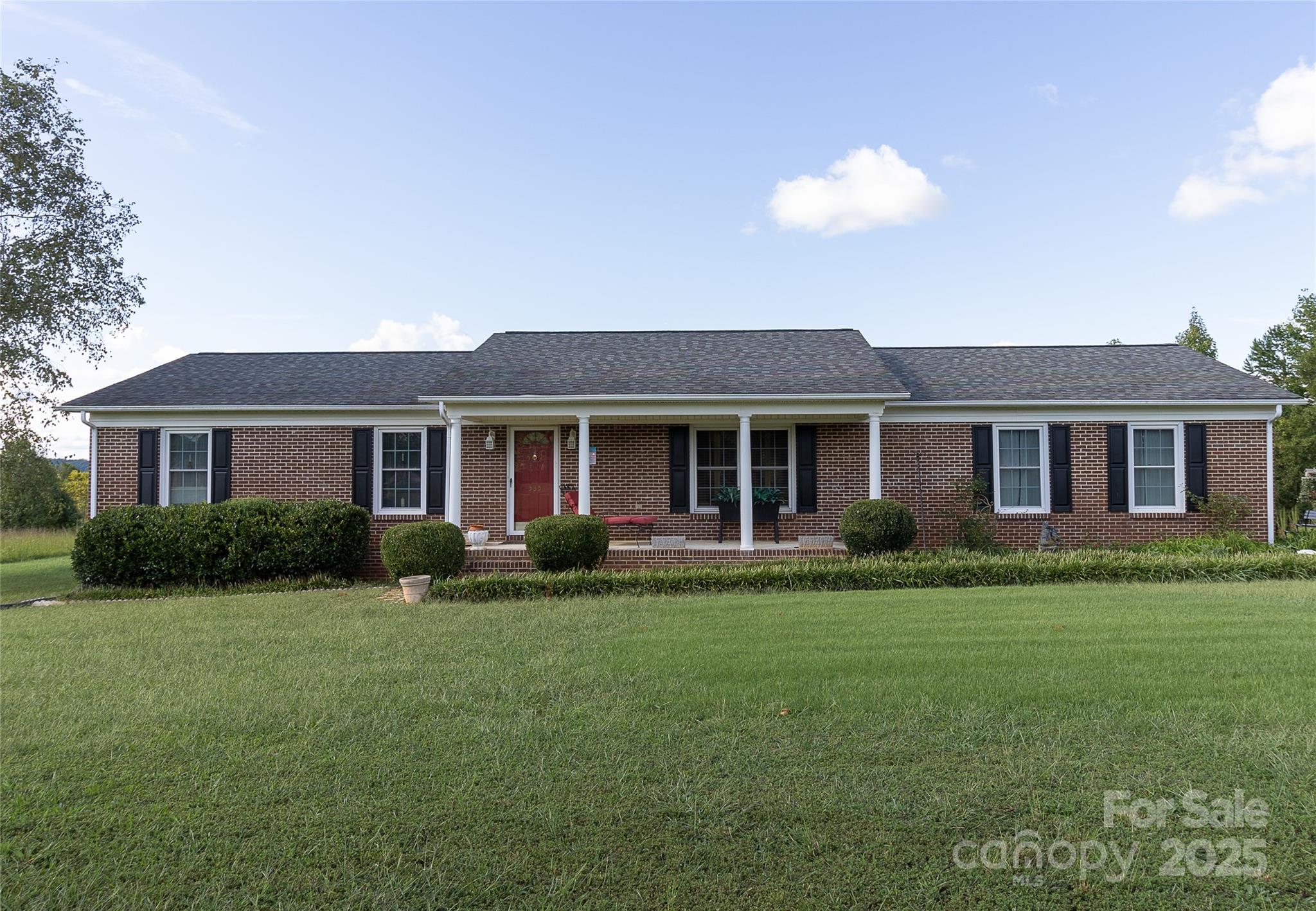 535 Holly Ridge Road Grover, NC 28073 - Photo 1 of 40 a front view of a house with a garden and porch