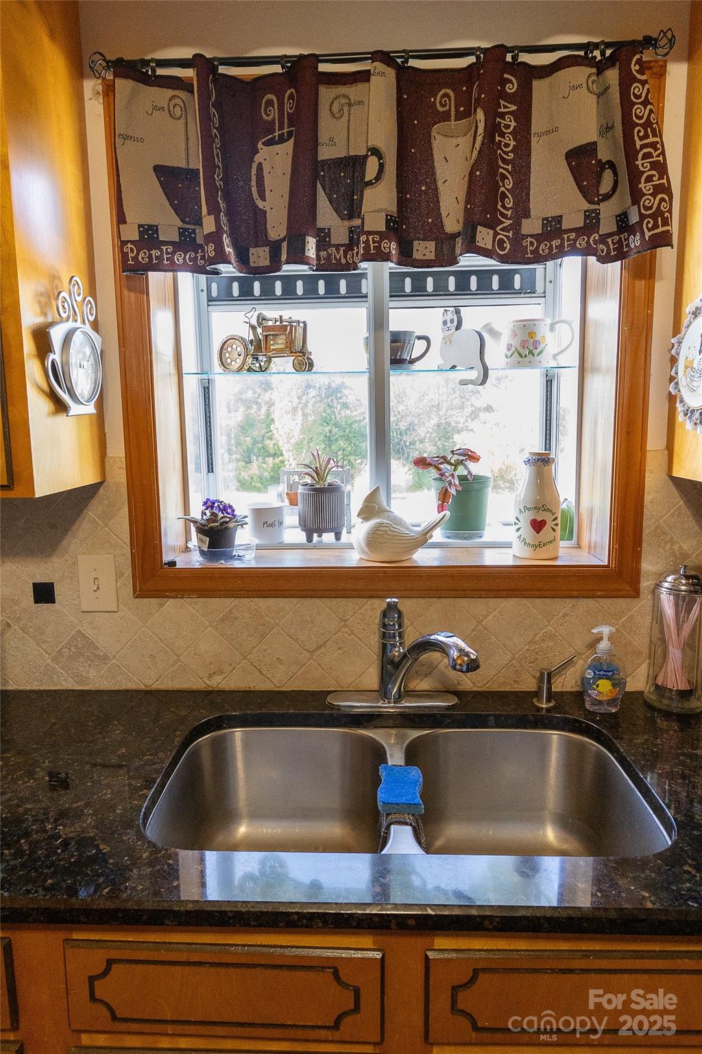 535 Holly Ridge Road Grover, NC 28073 - Photo 15 of 40 a kitchen sink with granite countertop a sink and cabinets