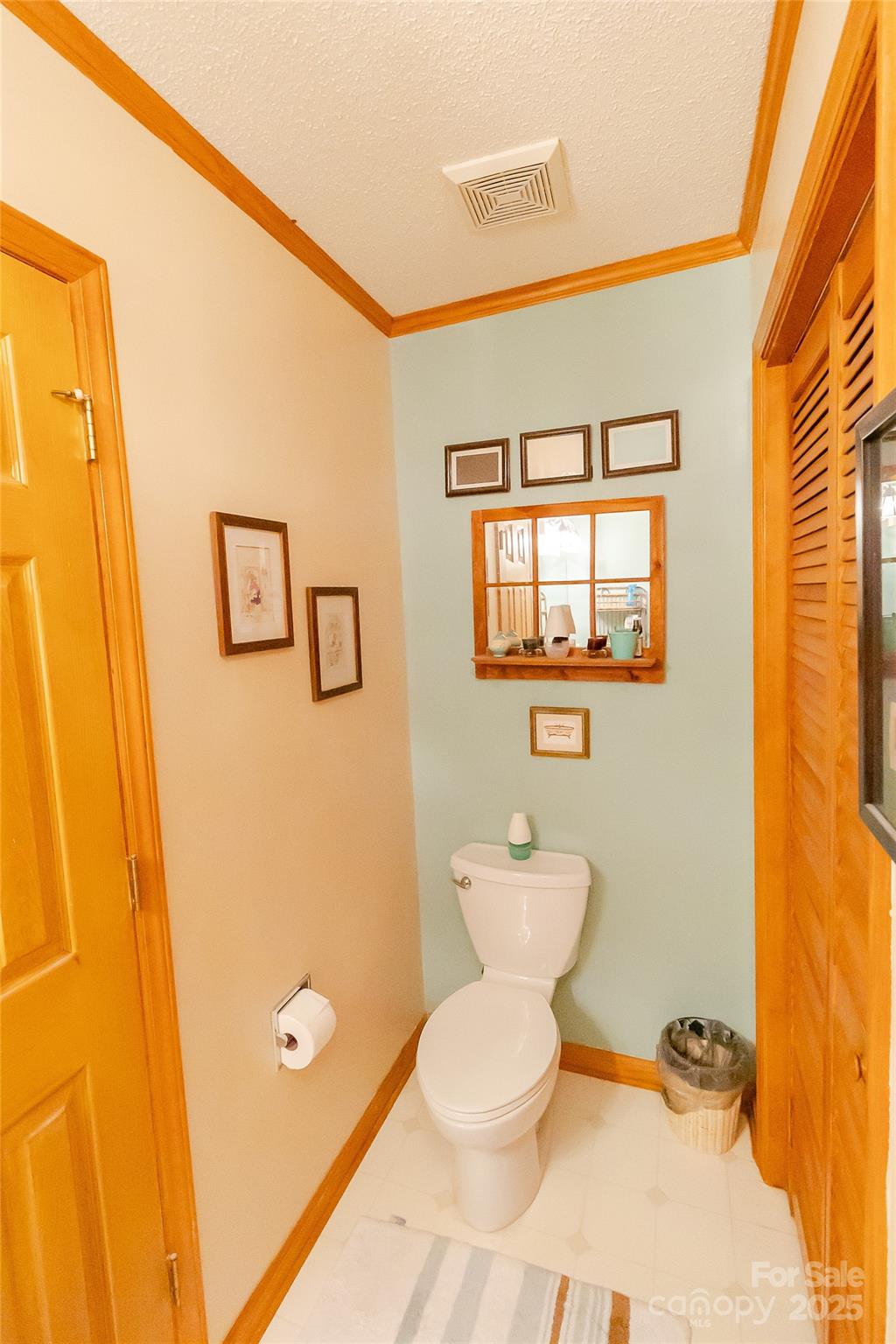 535 Holly Ridge Road Grover, NC 28073 - Photo 17 of 40 a bathroom with a toilet sink and a mirror