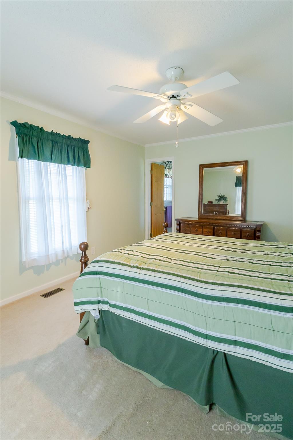 535 Holly Ridge Road Grover, NC 28073 - Photo 24 of 40 a spacious bedroom with a bed and a window
