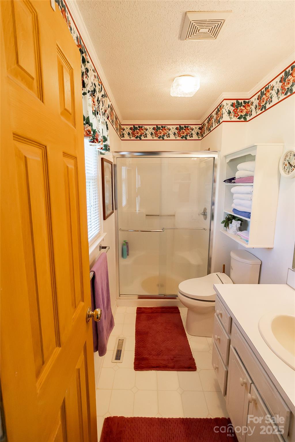 535 Holly Ridge Road Grover, NC 28073 - Photo 25 of 40 a bathroom with a sink toilet and shower