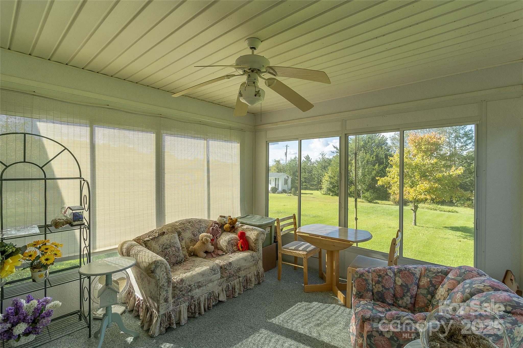 535 Holly Ridge Road Grover, NC 28073 - Photo 28 of 40 a living room with furniture and a floor to ceiling window