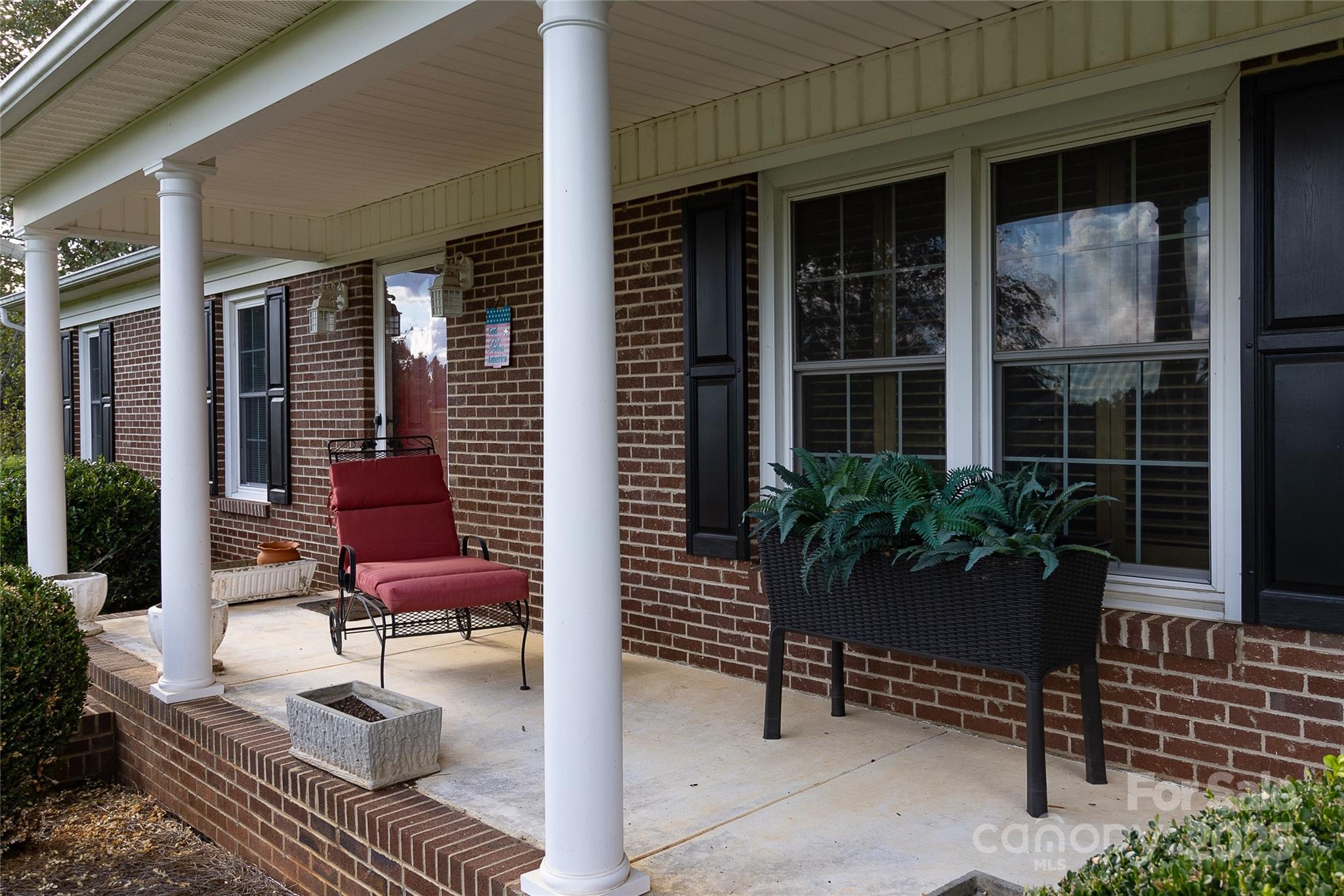 535 Holly Ridge Road Grover, NC 28073 - Photo 3 of 40 a house with a bench in patio
