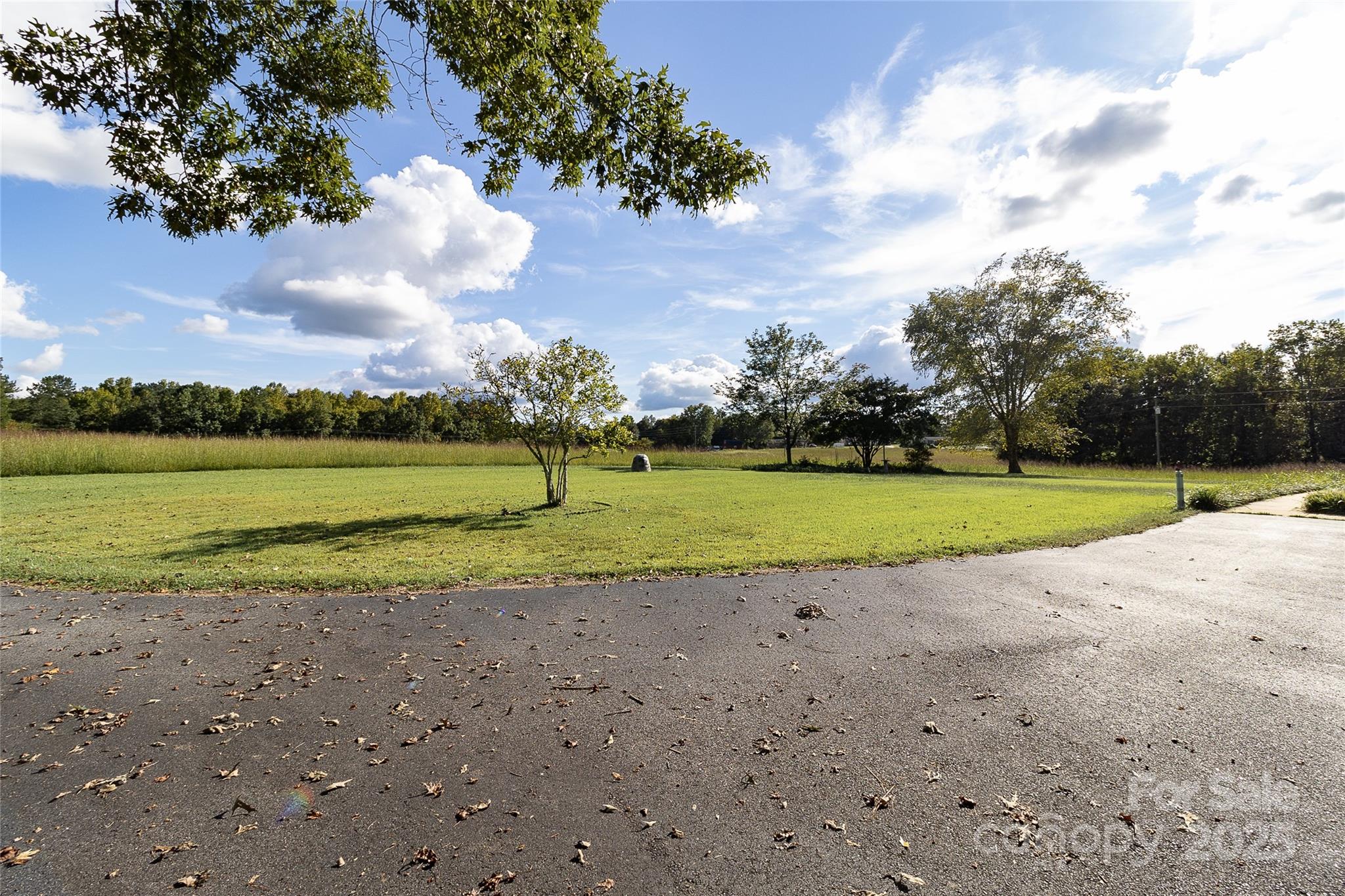 535 Holly Ridge Road Grover, NC 28073 - Photo 37 of 40 a view of a golf course with a lake