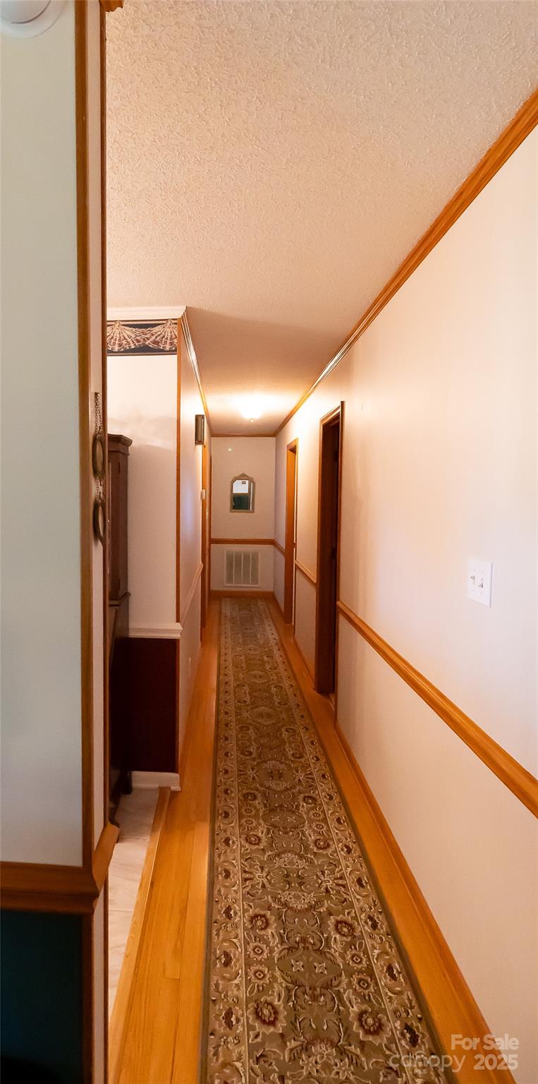 535 Holly Ridge Road Grover, NC 28073 - Photo 8 of 40 a view of hallway with wooden floor