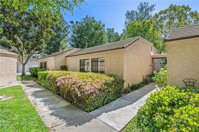 a front view of house with garden