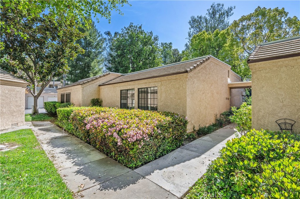 a front view of house with garden
