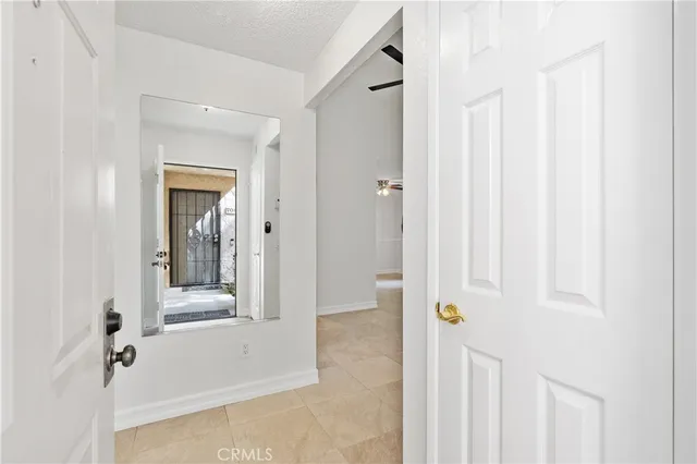 an empty room with furniture and a fireplace