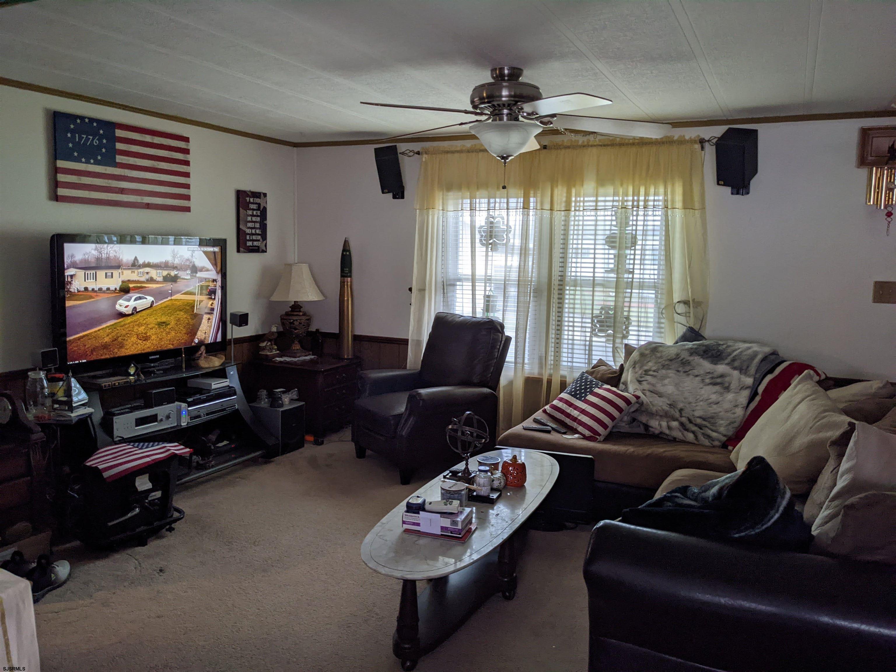 577 Miles Standish Lane Buena, NJ 08310 - Photo 12 of 25 a living room with furniture and a flat screen tv