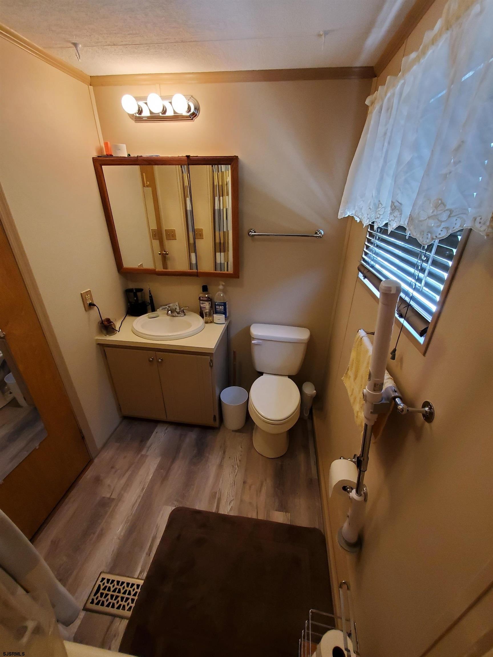 577 Miles Standish Lane Buena, NJ 08310 - Photo 16 of 25 a bathroom with a sink mirror toilet and bathtub