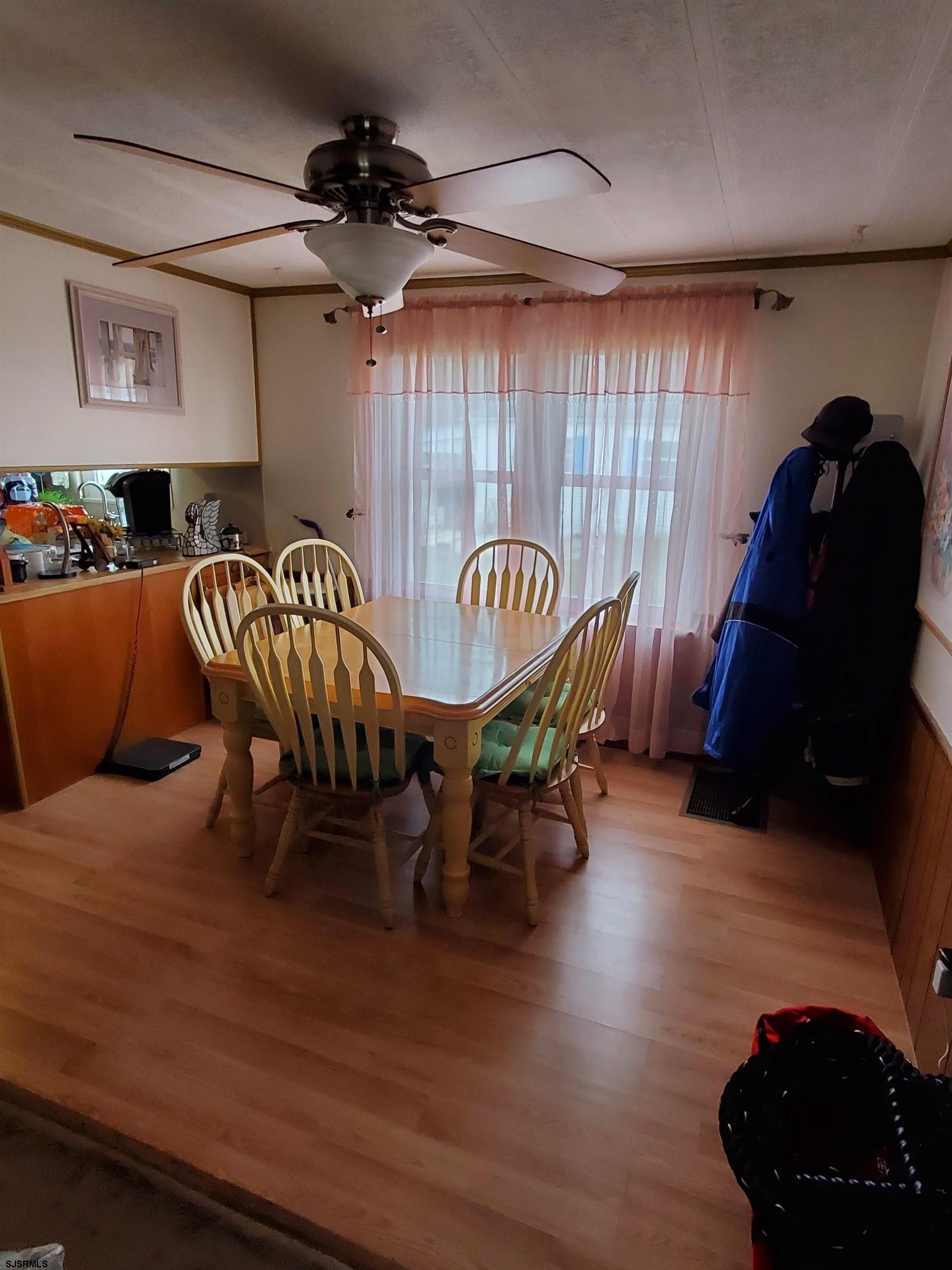 577 Miles Standish Lane Buena, NJ 08310 - Photo 8 of 25 a view of a dining room with furniture and chandelier