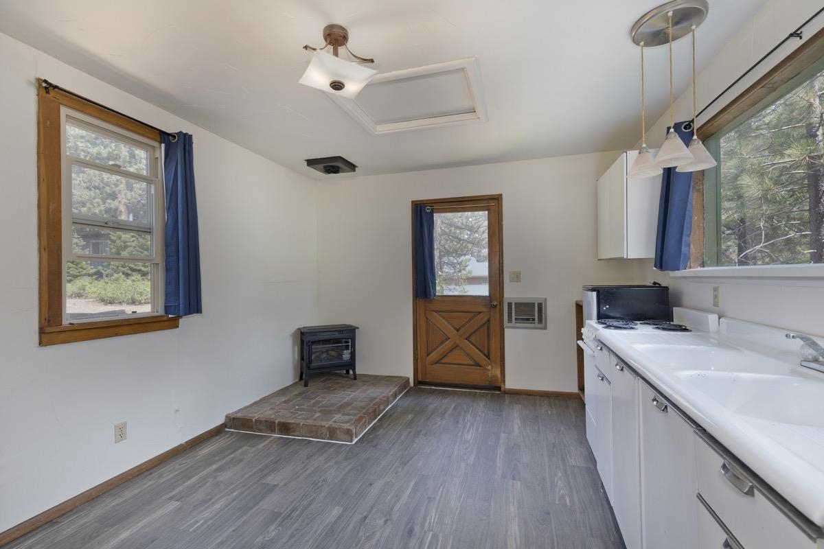 2030 Old Mammoth Road Mammoth Lakes, CA 93546 - Photo 29 of 46 a kitchen with a wooden floor and window