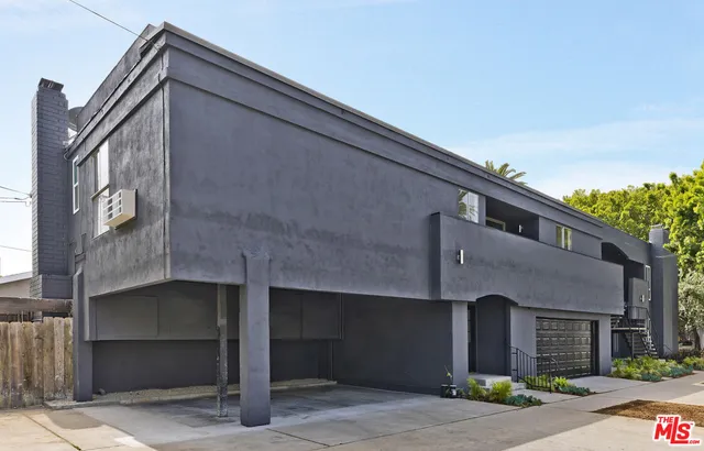 a front view of a building with garage