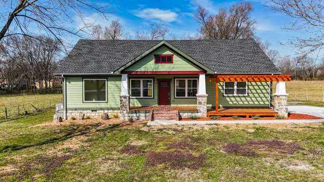 a house with swimming pool in front of it