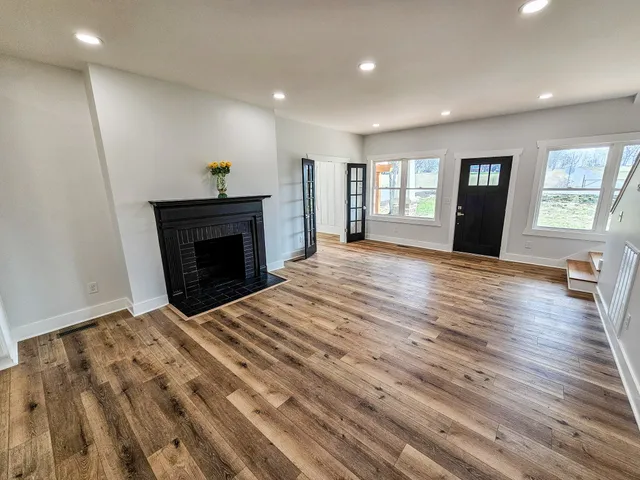 a view of kitchen with white cabinets