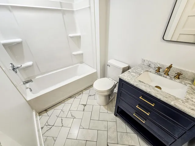 a view of a big room with wooden floor and staircase