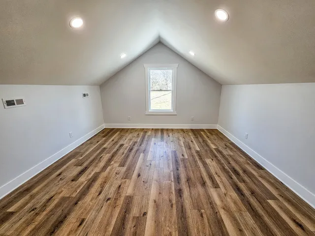 a view of a big room with wooden floor