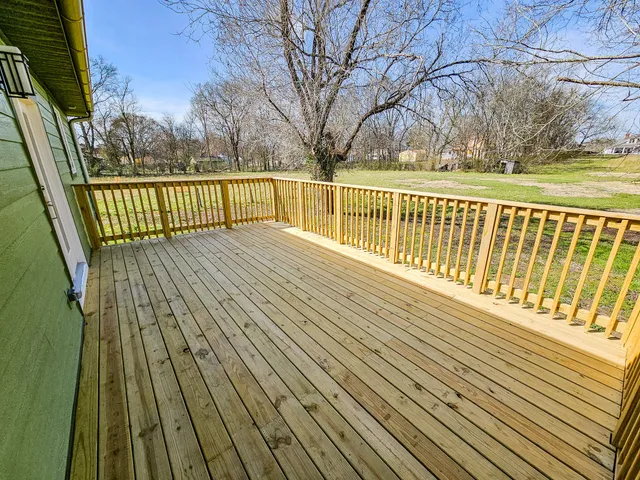 a view of balcony with wooden floor