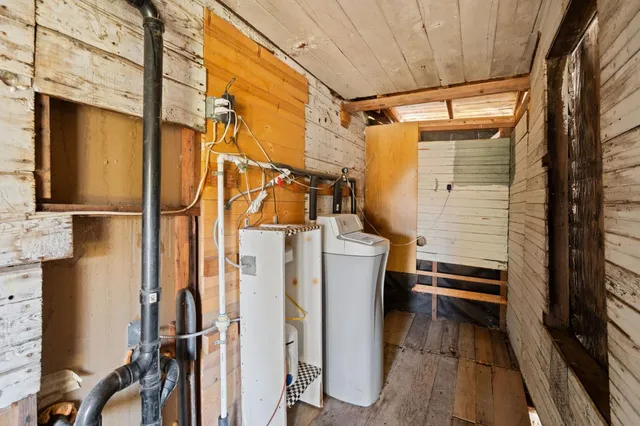 a view of a backyard with large trees