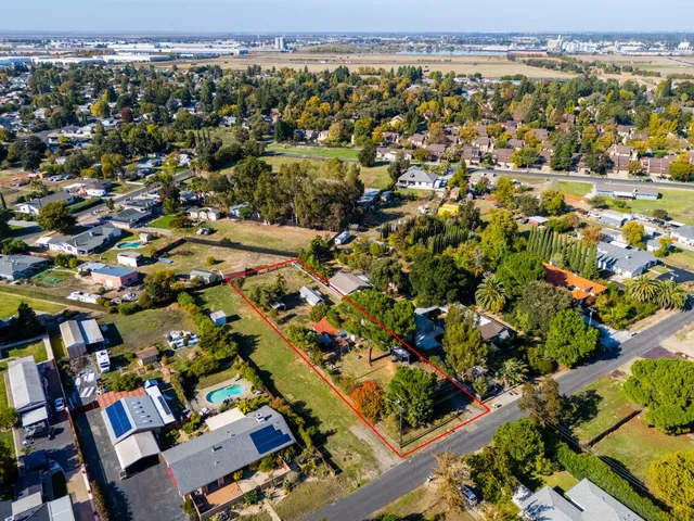 an aerial view of a houses with outdoor space