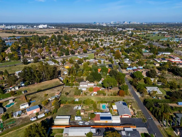 an aerial view of residential houses with outdoor space