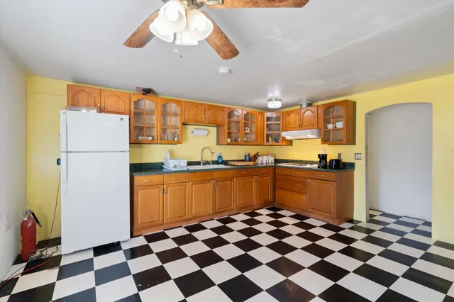 a kitchen with stainless steel appliances granite countertop a sink and a cabinets