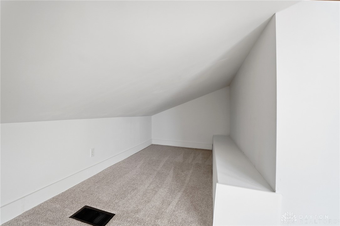 25 Englewood Road Springfield, OH 45504 - Photo 56 of 66 This cozy space features sloped ceilings and plush carpeting, ideal for a quiet retreat.