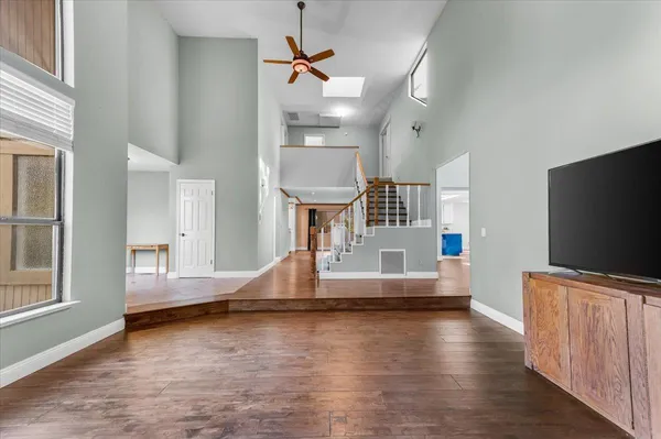 a living room with fireplace furniture and a flat screen tv