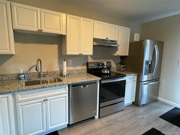 a swimming pool with outdoor seating and yard