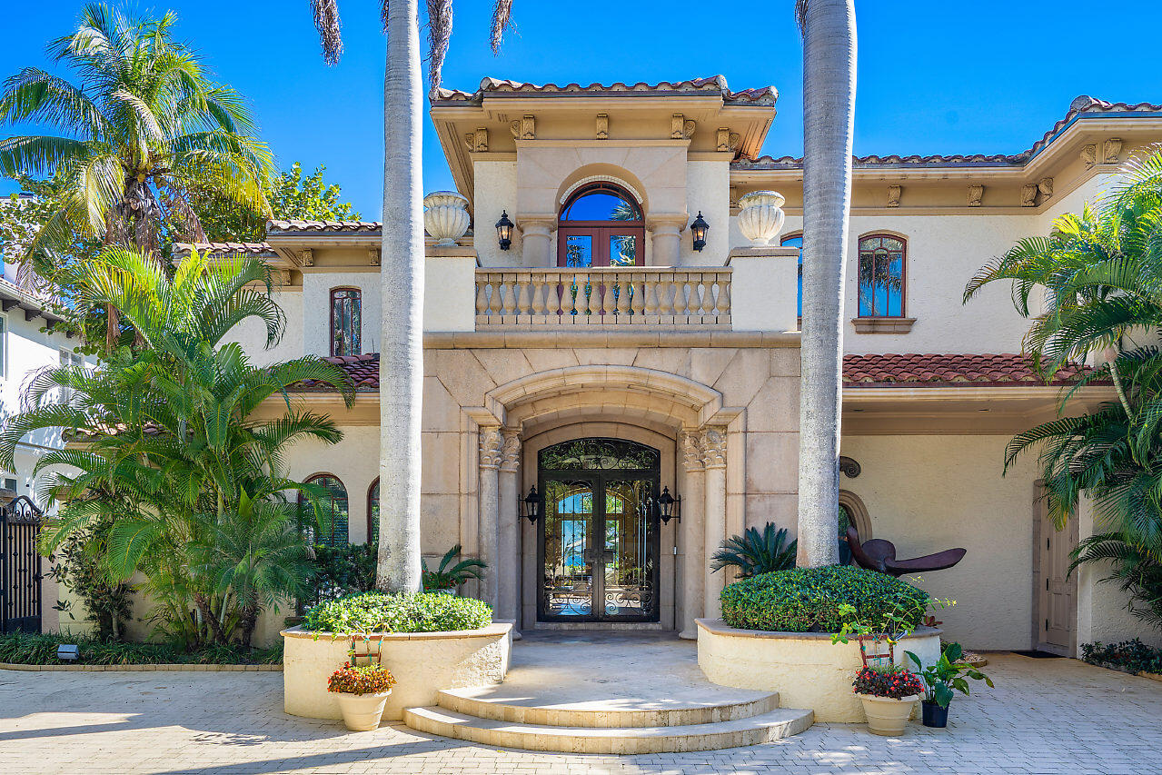 719 North Ocean Boulevard Delray Beach, FL 33483 - Photo 3 of 56 a view of a house with potted plants