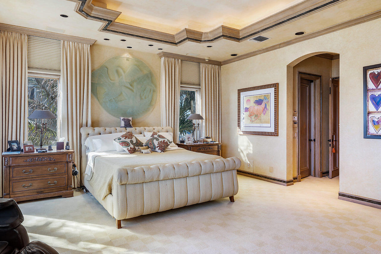 719 North Ocean Boulevard Delray Beach, FL 33483 - Photo 31 of 56 a bedroom with a bed mirror and window