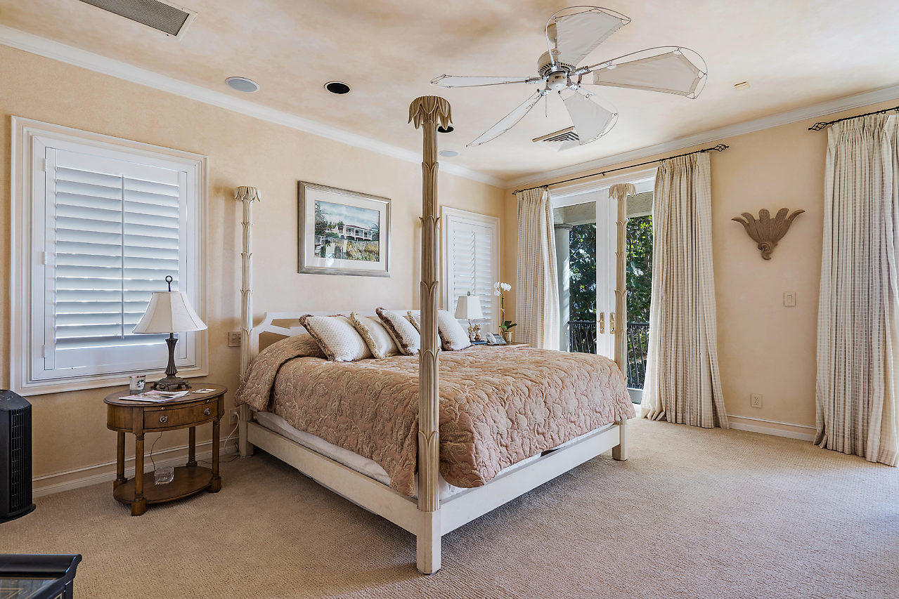 719 North Ocean Boulevard Delray Beach, FL 33483 - Photo 37 of 56 a spacious bedroom with a bed and a table