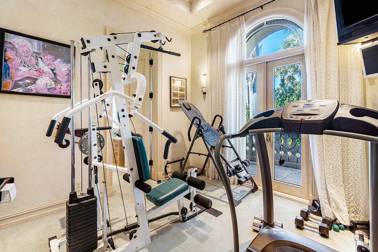 719 North Ocean Boulevard Delray Beach, FL 33483 - Photo 38 of 56 a view of a room with gym equipment