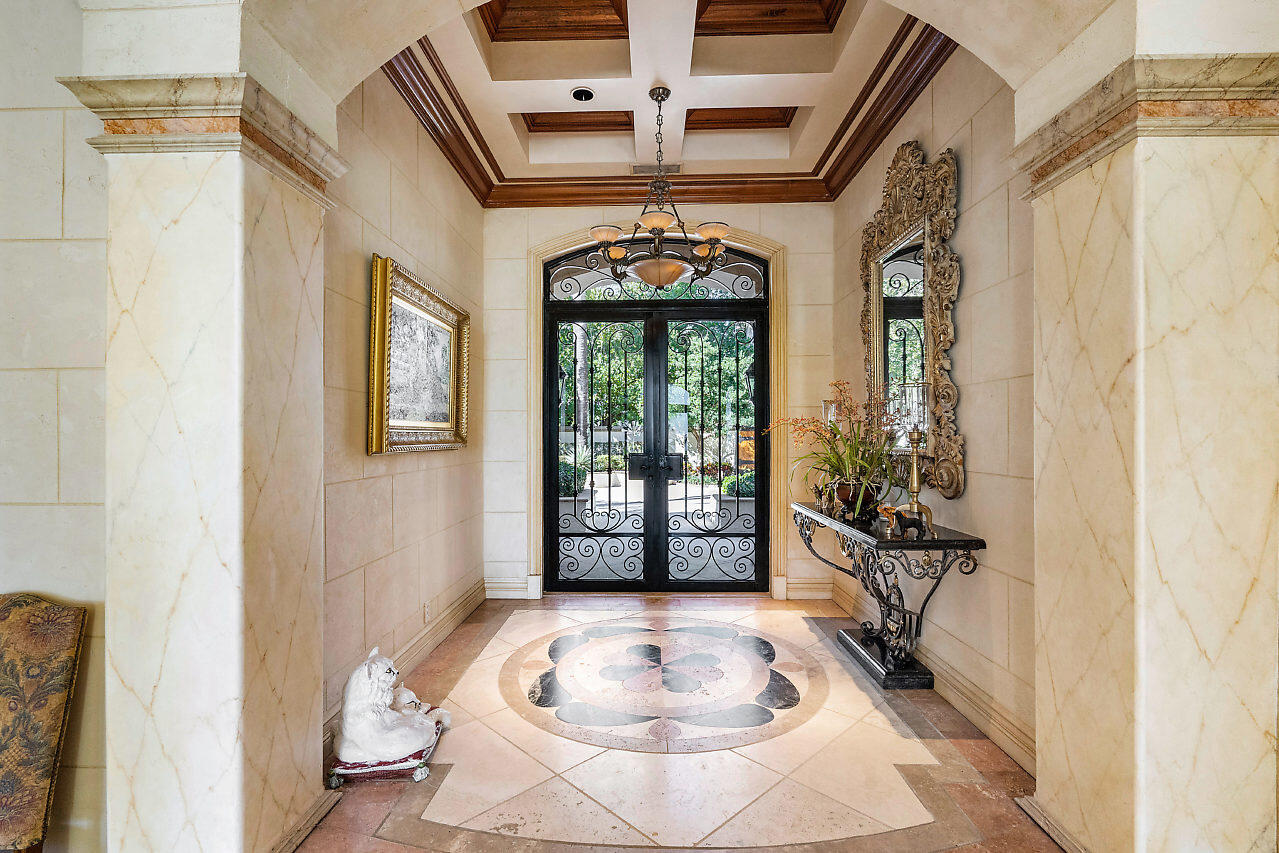 719 North Ocean Boulevard Delray Beach, FL 33483 - Photo 5 of 56 a view of a hallway with windows and front door