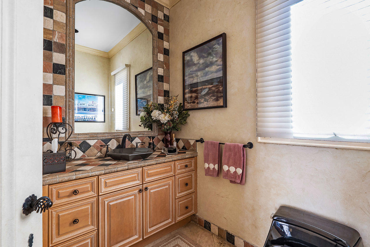 719 North Ocean Boulevard Delray Beach, FL 33483 - Photo 43 of 56 a bathroom with a sink and a mirror