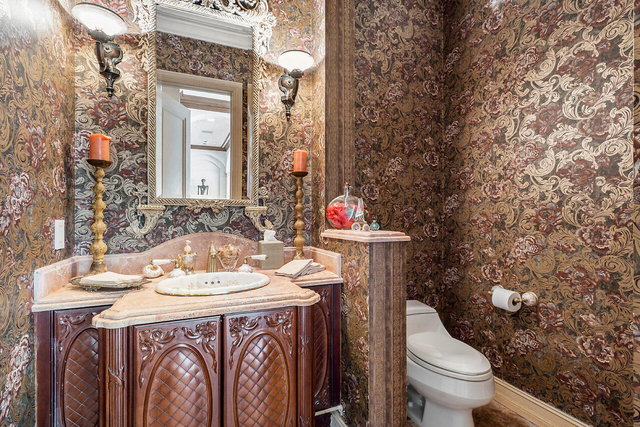 719 North Ocean Boulevard Delray Beach, FL 33483 - Photo 46 of 56 a bathroom with a sink and a toilet