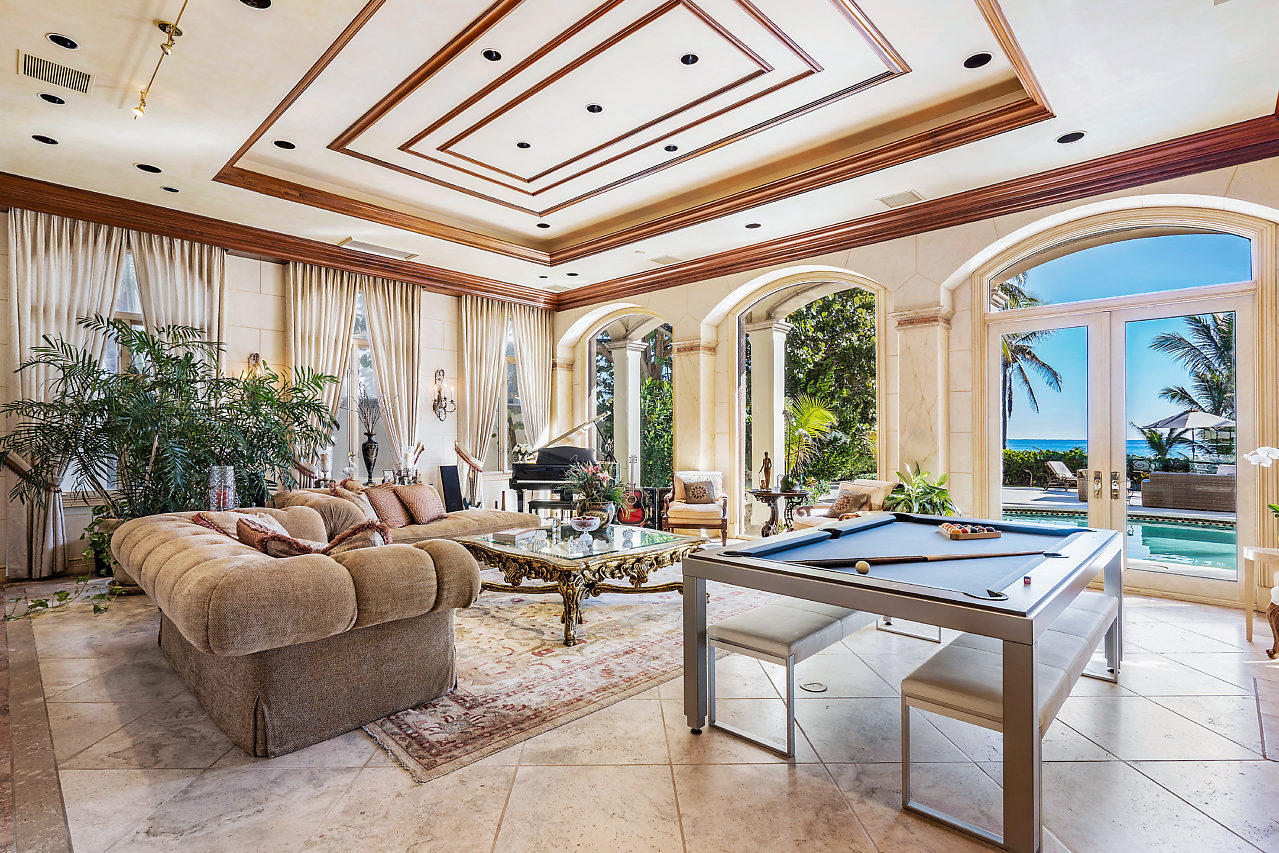 719 North Ocean Boulevard Delray Beach, FL 33483 - Photo 6 of 56 a living room with furniture and floor to ceiling window