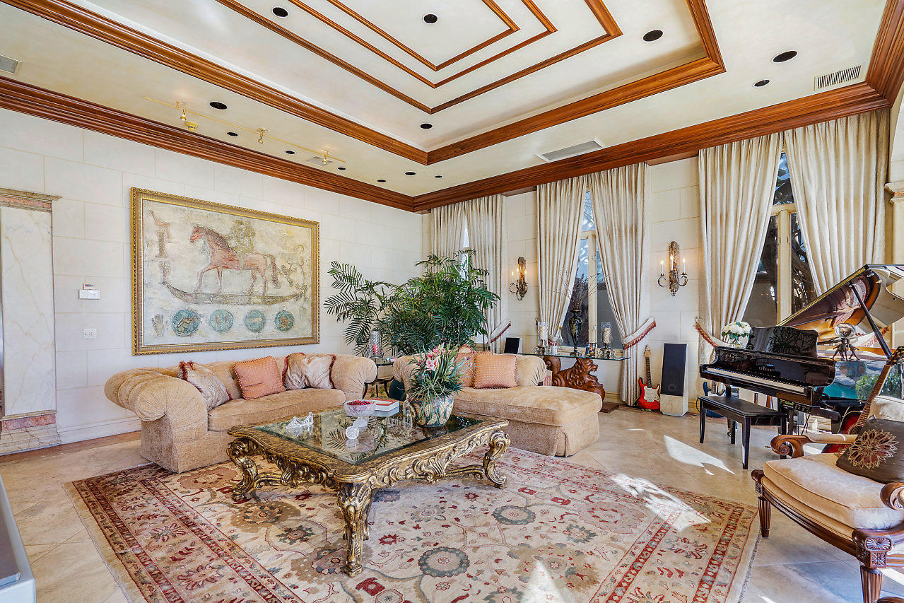 719 North Ocean Boulevard Delray Beach, FL 33483 - Photo 7 of 56 a living room with furniture a rug and a large window