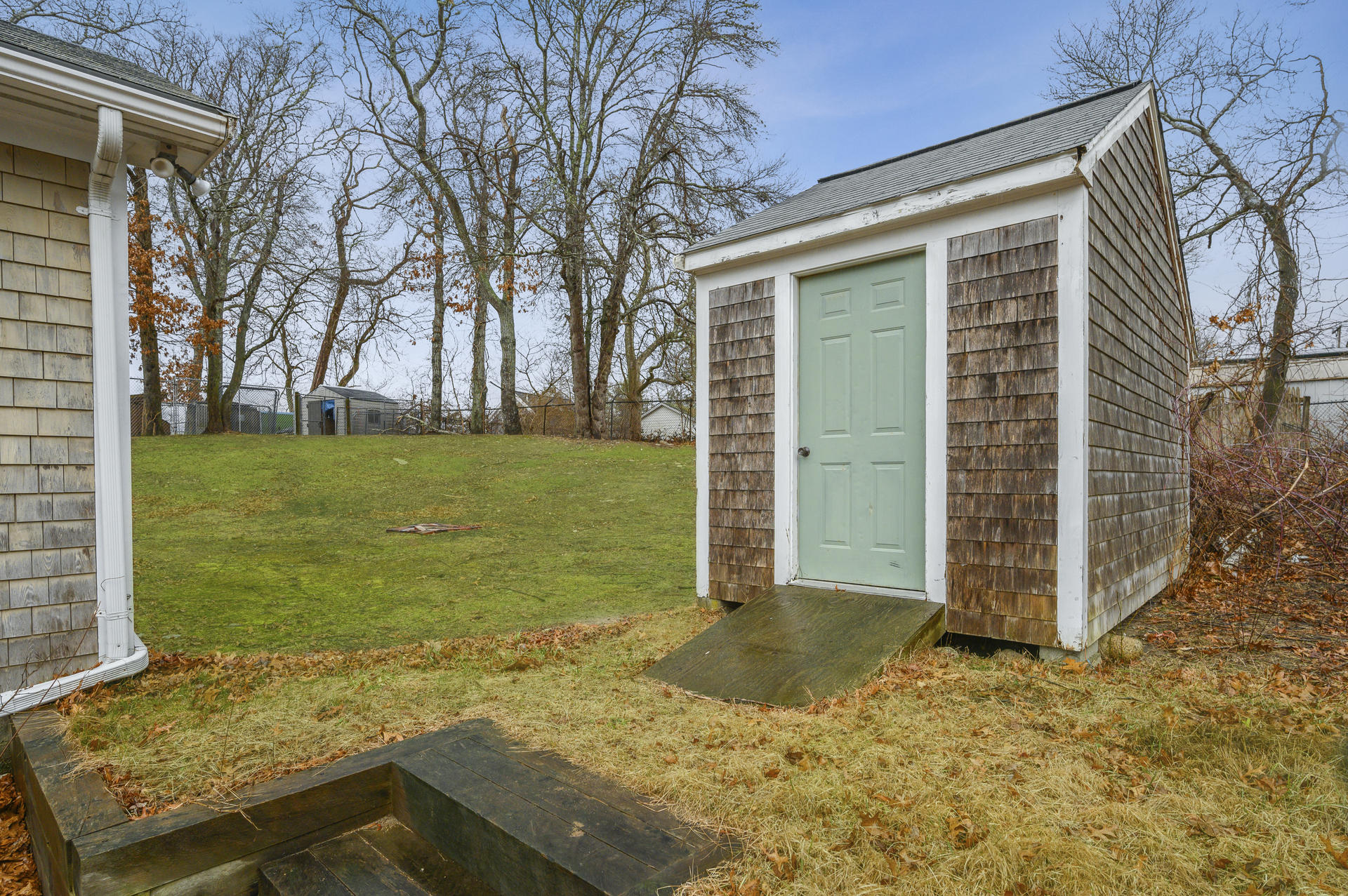8 Indian Neck Road Wareham, MA 02571 - Photo 15 of 18 a view of a backyard with wooden fence
