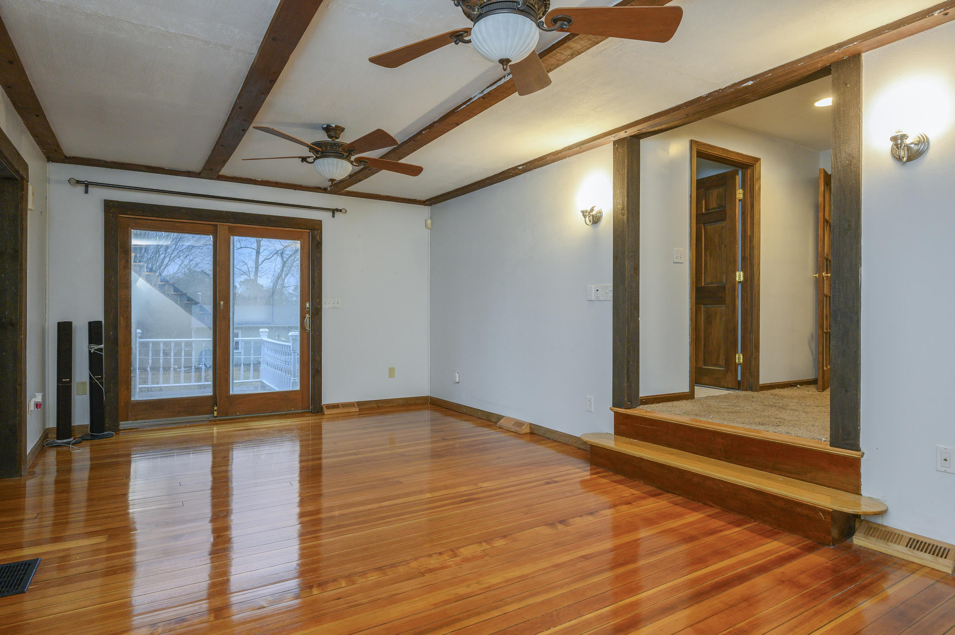 8 Indian Neck Road Wareham, MA 02571 - Photo 5 of 18 a view of an empty room with wooden floor and a window