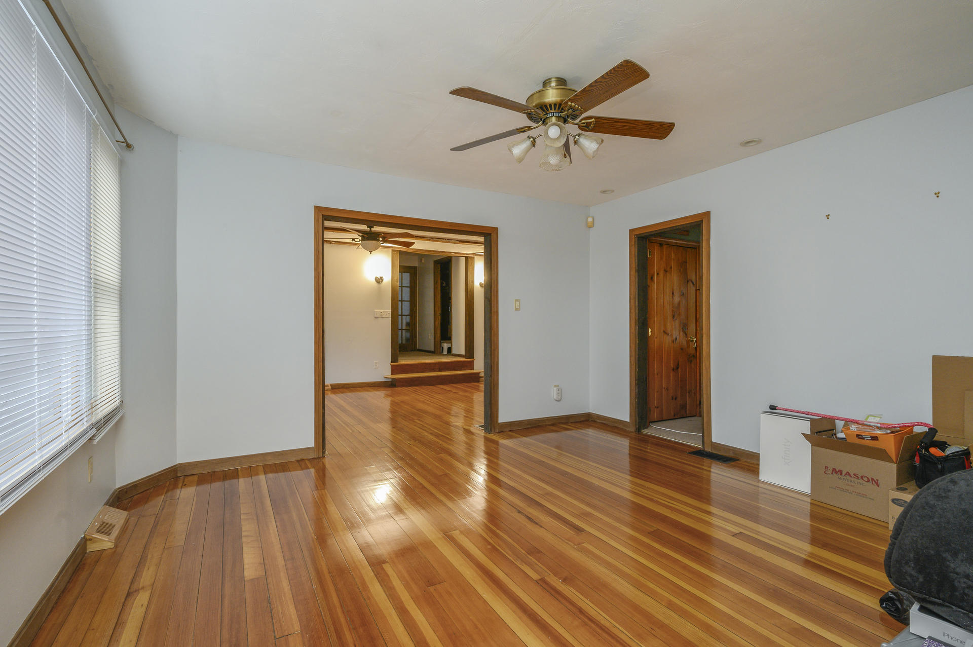 8 Indian Neck Road Wareham, MA 02571 - Photo 6 of 18 a view of empty room with wooden floor and fan