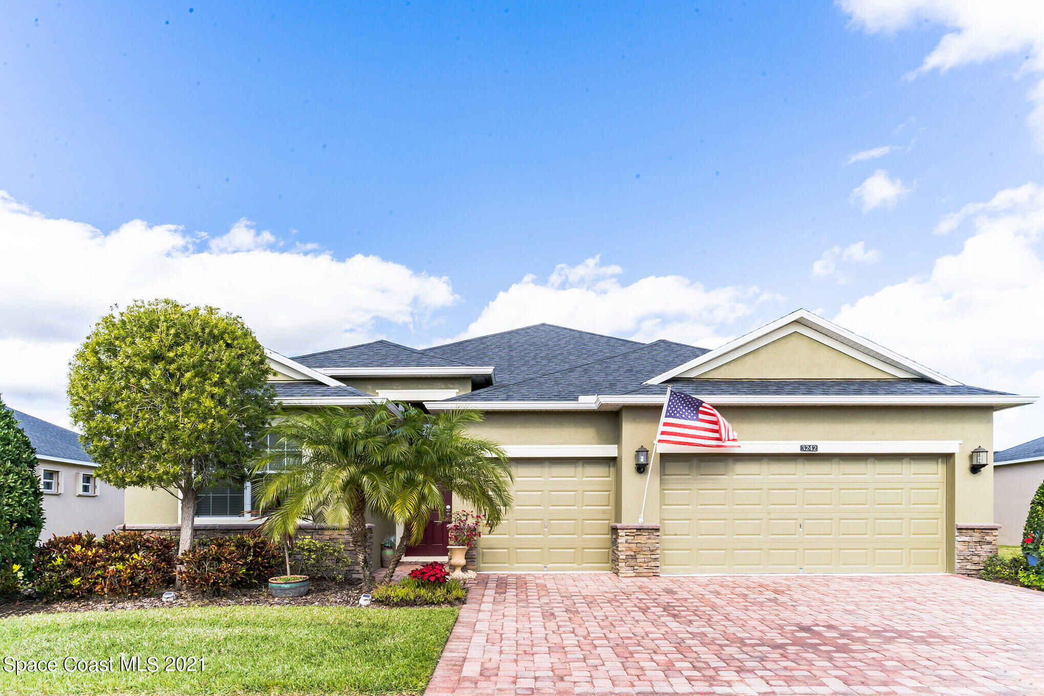 3242 Balboa Place Melbourne, FL 32940 - Photo 1 of 34 a front view of a house with a garden and plants