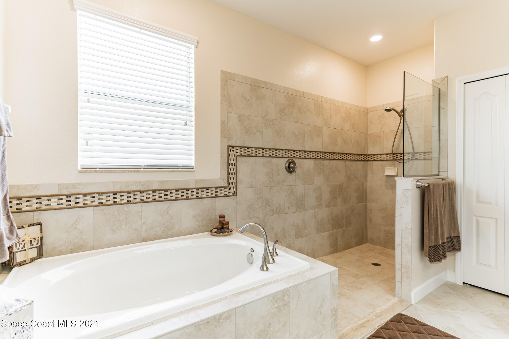 3242 Balboa Place Melbourne, FL 32940 - Photo 23 of 34 a white bath tub sitting next to a shower