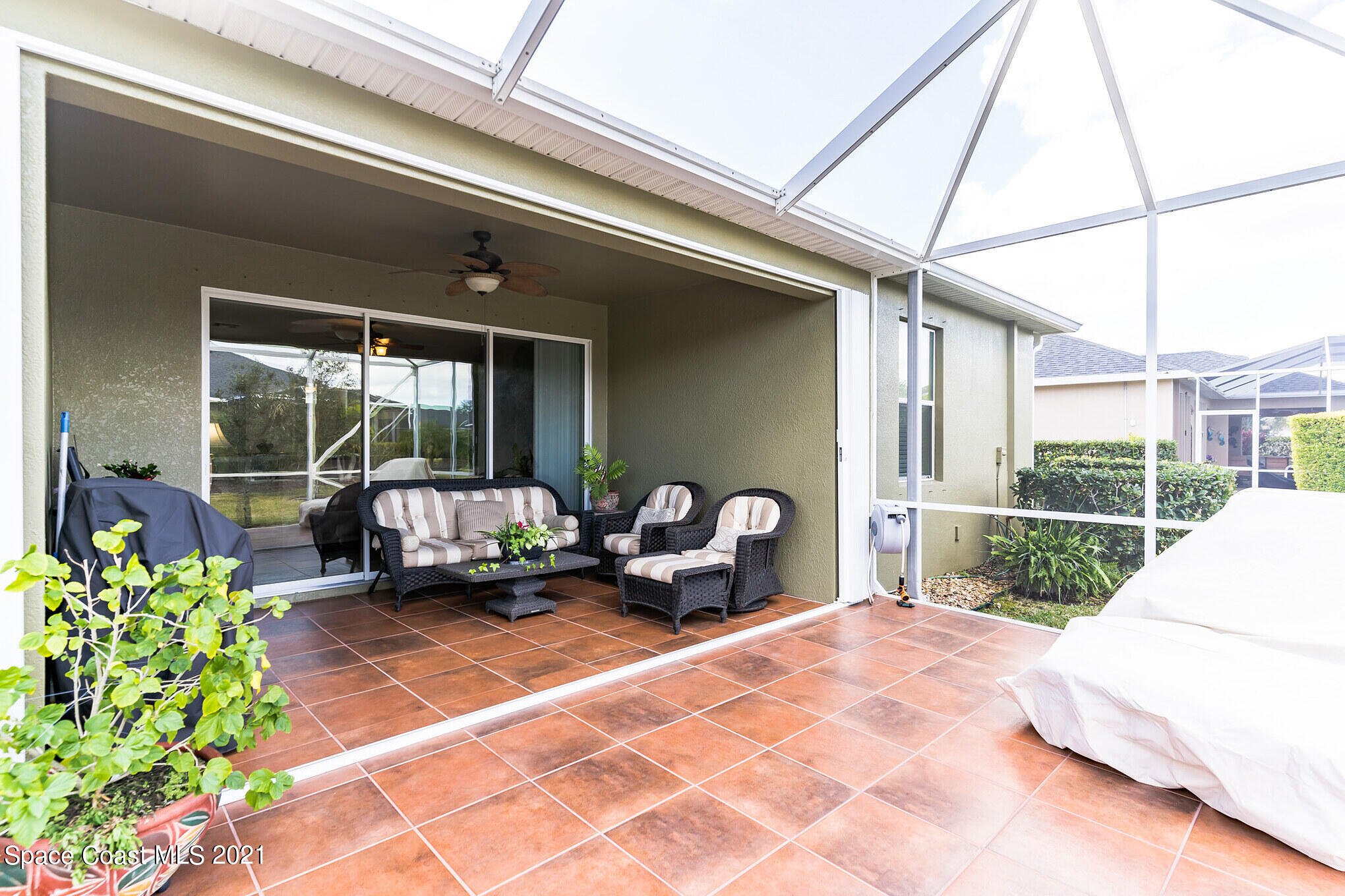3242 Balboa Place Melbourne, FL 32940 - Photo 26 of 34 a balcony view with a couch and table chair