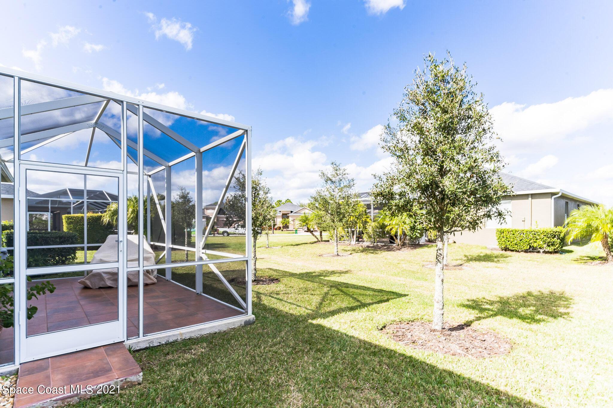 3242 Balboa Place Melbourne, FL 32940 - Photo 28 of 34 a view of a house with backyard and patio