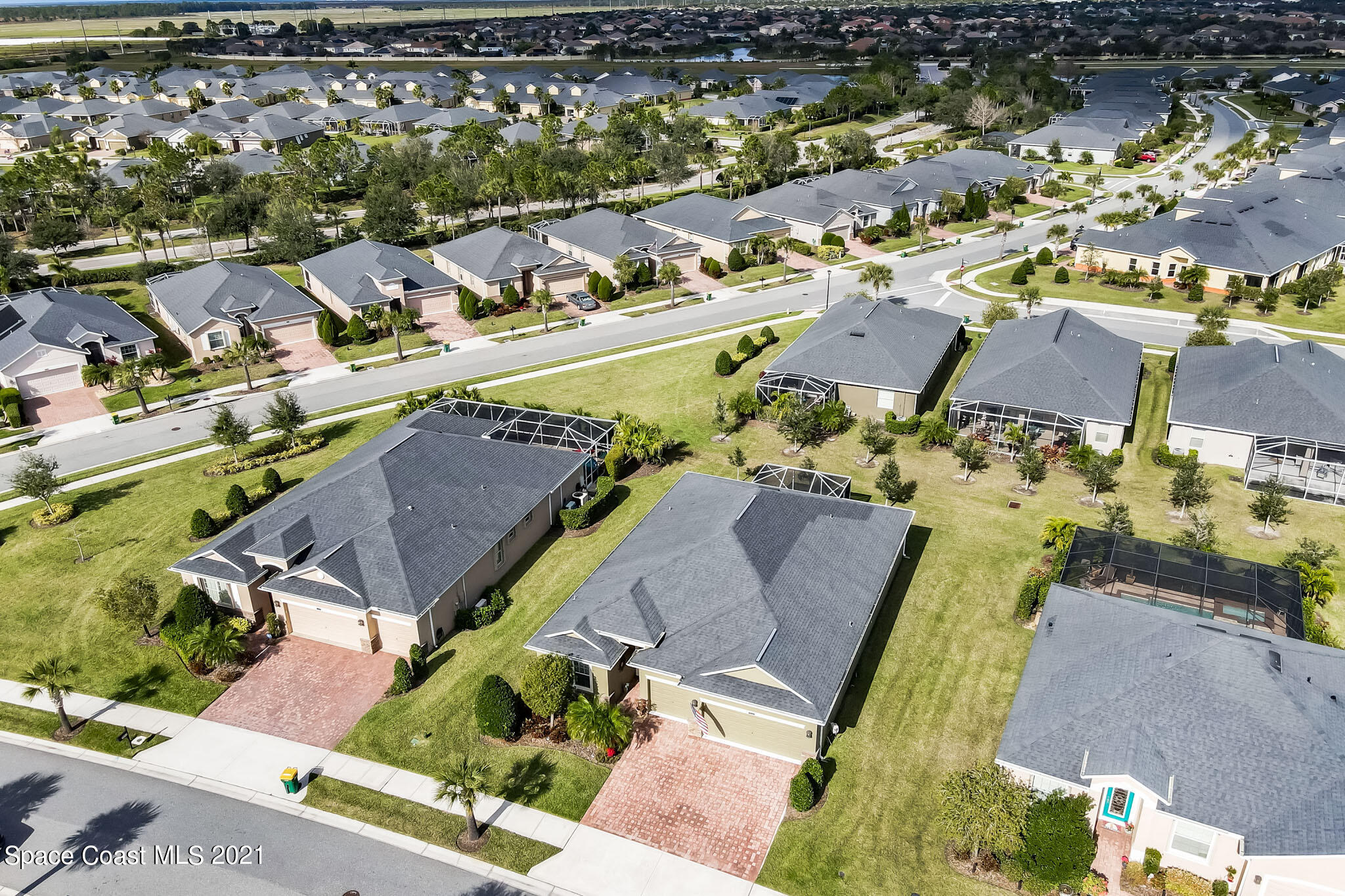 3242 Balboa Place Melbourne, FL 32940 - Photo 32 of 34 an aerial view of residential houses with outdoor space