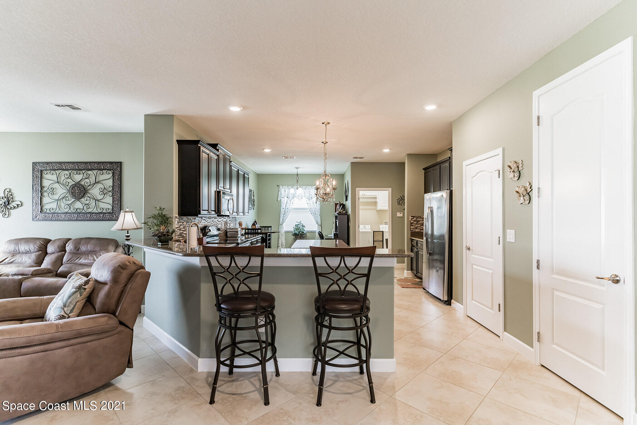 3242 Balboa Place Melbourne, FL 32940 - Photo 6 of 34 a view of a dining room with furniture