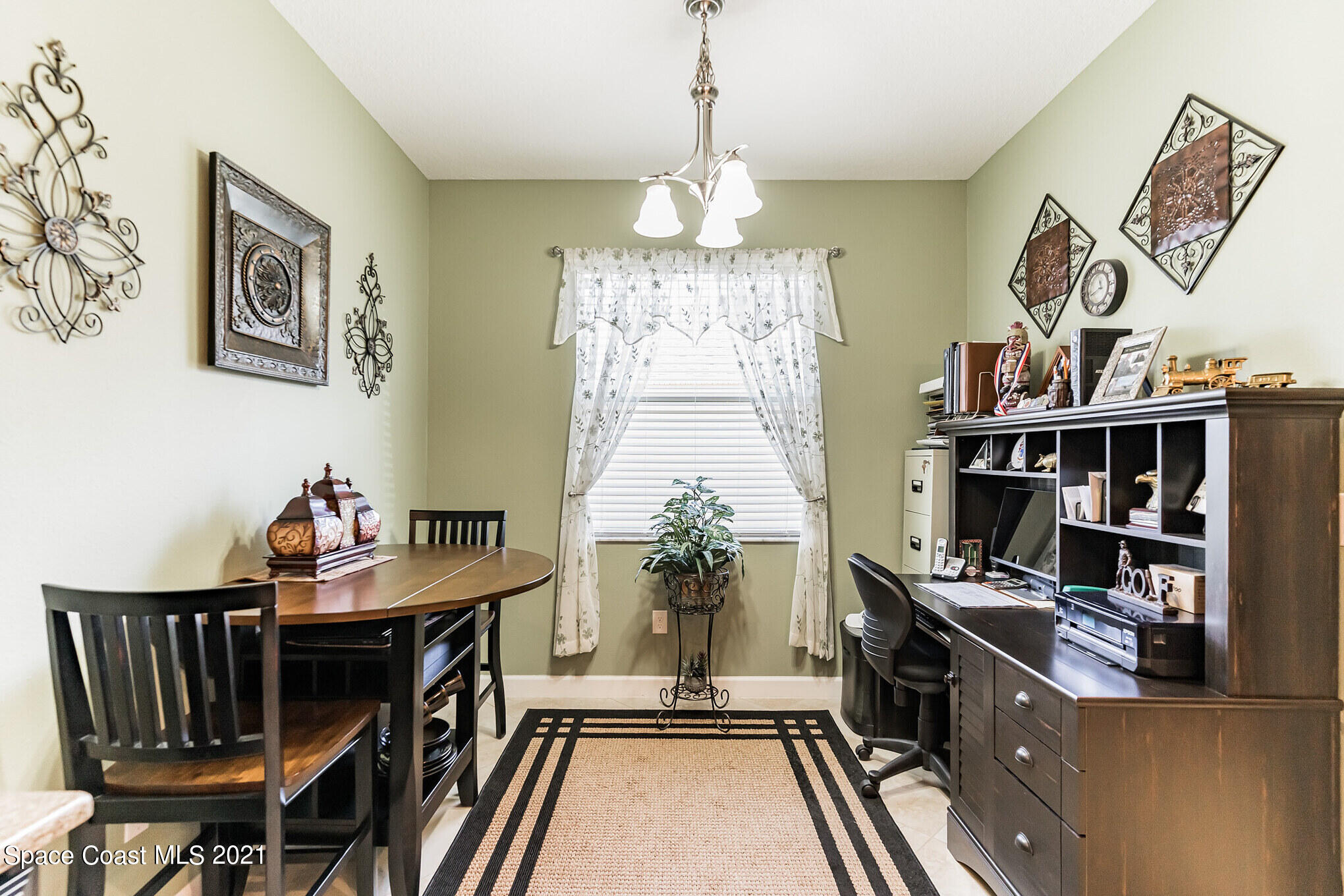 3242 Balboa Place Melbourne, FL 32940 - Photo 8 of 34 a view of a dining room with furniture window and wooden floor