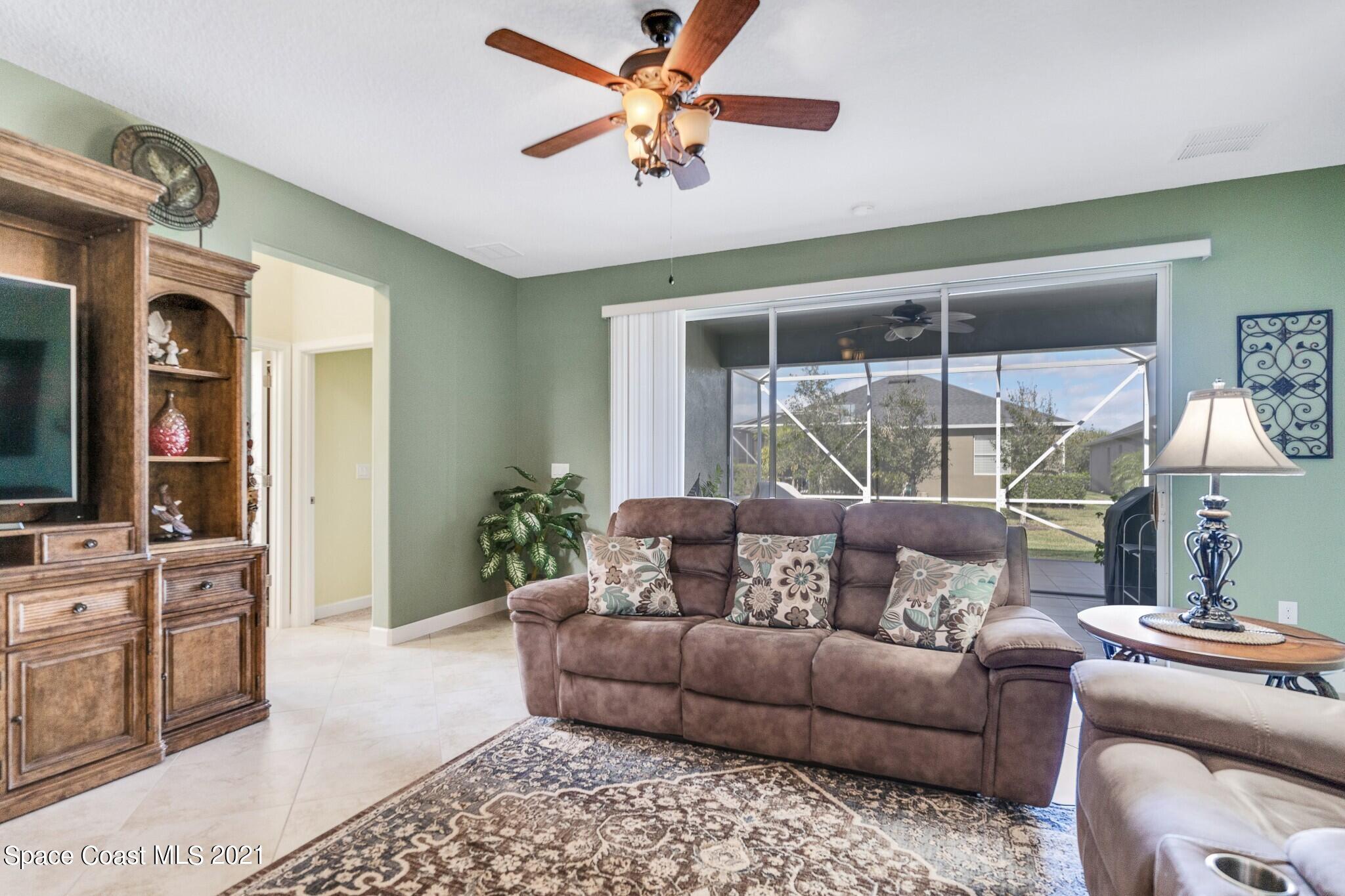 3242 Balboa Place Melbourne, FL 32940 - Photo 10 of 34 a living room with furniture and a window