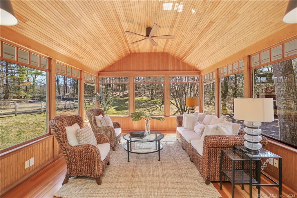 With walls of windows surrounding, you have a panoramic view of the grounds throughout every season. Gas stove could be added.